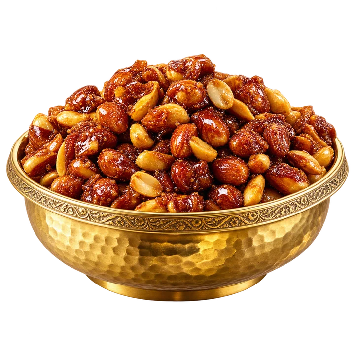 Sweet jaggery peanuts in a gold bowl